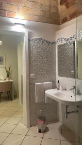 a bathroom with a sink and a glass shower at Barbarossa Sea Room in Termoli