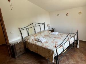 a bedroom with a bed and a wooden dresser at Agriturismo San Michele in San Michele