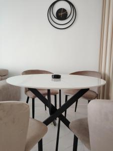 a white table and chairs in a room at Seratlić Lux 27 in Bar +32 photos