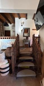 a room with a staircase with chairs and a mirror at Chalet St John in Slatino +13 photos