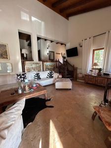 a large living room with a couch and a tv at Chalet St John in Slatino