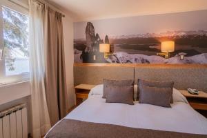Postel nebo postele na pokoji v ubytování Hotel Tres Reyes