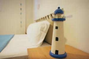 Postel nebo postele na pokoji v ubytování Faros Hotel