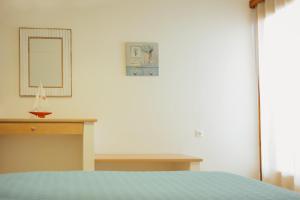 Postel nebo postele na pokoji v ubytování Faros Hotel