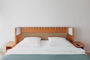 Postel nebo postele na pokoji v ubytování Hotel Cristallo