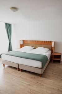 Postel nebo postele na pokoji v ubytování Hotel Cristallo