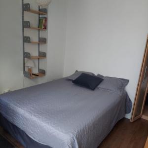 Ένα ή περισσότερα κρεβάτια σε δωμάτιο στο Hospedaje de Raimundo y Monica