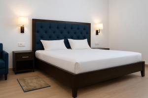 Postel nebo postele na pokoji v ubytování Hotel Chamba Dhanjeet Palace