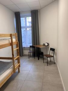Postel nebo postele na pokoji v ubytování Golden Hostel