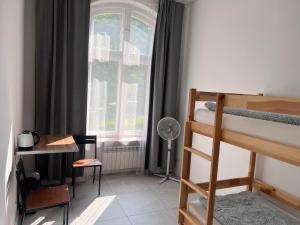 Postel nebo postele na pokoji v ubytování Golden Hostel
