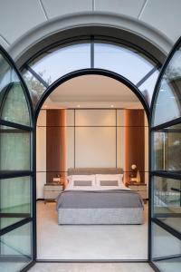 Ένα ή περισσότερα κρεβάτια σε δωμάτιο στο Villa Anna Enchanting view on Isola Comacina +46 φωτογραφίες