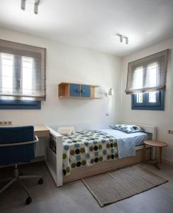 Postel nebo postele na pokoji v ubytování Villa Glysidia Sunset with swimming pool & BBQ