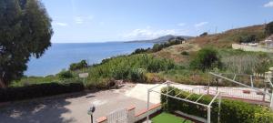 a view of the ocean from a house at Blue Sea Apartment Makauda in Ribera +6 photos