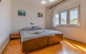 Ένα ή περισσότερα κρεβάτια σε δωμάτιο στο Two Bedroom Cozy Apartment In Liznjan