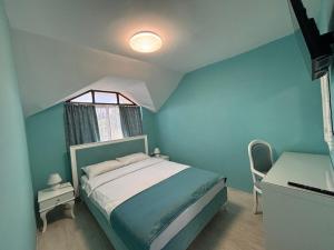 A bed or beds in a room at Sozopol Romance Apartments