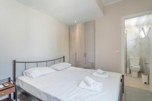 Postel nebo postele na pokoji v ubytování Stathis Home