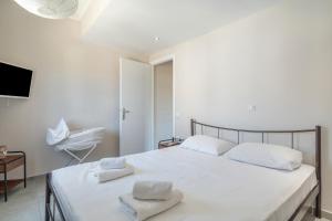 Postel nebo postele na pokoji v ubytování Stathis Home