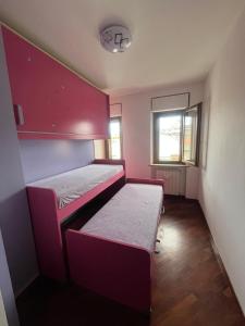 a small room with two bunk beds and a window at Maddalena House in Vasto +31 photos