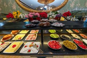 a buffet filled with different types of food at Nil Hotel İstanbul City Center in Istanbul