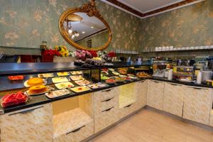 a buffet line with plates of food on display at Nil Hotel İstanbul City Center in Istanbul