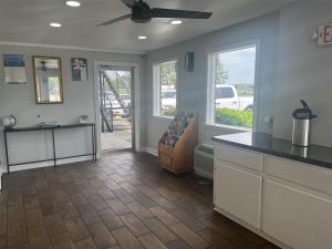 a room with a kitchen with a counter top at Motel 6 Saint George, SC – I-95 in Saint George