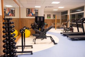 a gym with treadmills and elliptical machines at Portobello Ondina Praia in Salvador