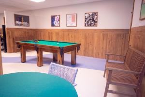 a room with a pool table and a chair at Portobello Ondina Praia in Salvador +72 photos
