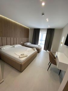 Postel nebo postele na pokoji v ubytování Velmar Hotel