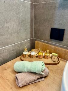 a bathroom with a sink and a towel on a table at TriPeak in Bjelašnica +33 photos