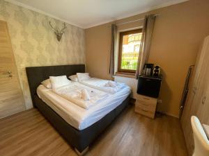 Postel nebo postele na pokoji v ubytování Nockalm Cottage