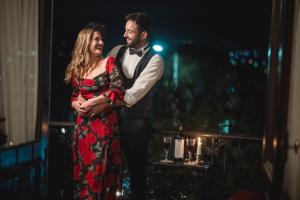 a man and a woman standing next to a window at Juliette Posada Boutique in Villa Carlos Paz +251 photos