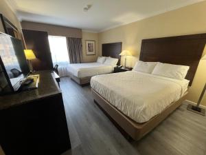 Postel nebo postele na pokoji v ubytování Quality Inn Saint-Jean-sur-Richelieu
