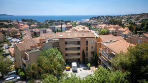 an aerial view of a building in a city at Le Corsaire - Séjour Relaxant, Plage & Piscine in Carqueiranne