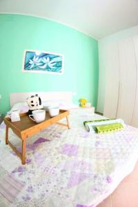 Ένα ή περισσότερα κρεβάτια σε δωμάτιο στο Casa Vacanze Aurora