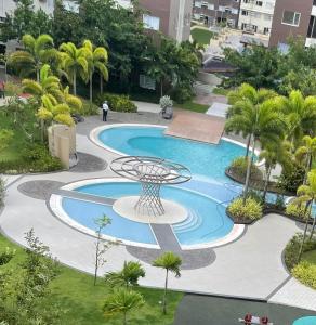 an overhead view of a swimming pool in a resort at Great Location, Swimming pool, Shops, Staycation in Iloilo City