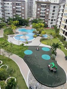 an aerial view of a park with a pool at Great Location, Swimming pool, Shops, Staycation in Iloilo City +19 photos