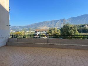 a balcony with a view of a mountain at Simple Apartment in Orikum +4 photos