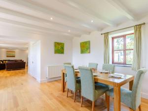 a dining room with a table and chairs at 3 Bed in Praa Sands 36257 in Germoe