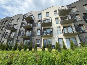 an apartment building with balconies on the side of it at B50 Trzy Lipki - Apartament Bielsko - WGH Rent in Bielsko-Biala