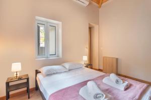 Postel nebo postele na pokoji v ubytování Ionian Home