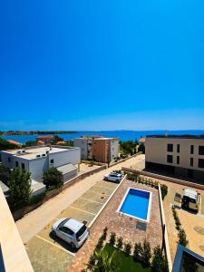 an aerial view of a parking lot with a pool at Crystal Adria in Privlaka