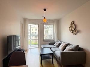 Khu vực ghế ngồi tại Cozy two bedroom apartment close to Westfield Täby Centrum