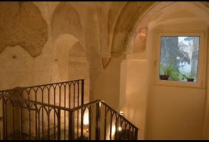 a staircase in a building with a window at Domus Lina in Ravello