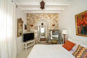 Μια τηλεόραση ή/και κέντρο ψυχαγωγίας στο Villa BlueRock by Mykonos Mood