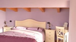 Letto o letti in una camera di Agriturismo La Palazzina di Gorgognano