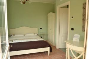 Letto o letti in una camera di Agriturismo La Palazzina di Gorgognano