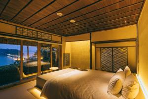 Katil atau katil-katil dalam bilik di Gamagori Classic Hotel