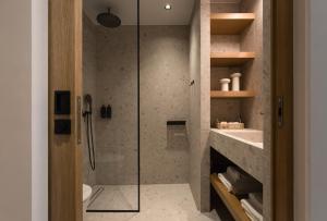 a bathroom with a shower with a glass door at Memoire Guest House I Private Heated Pool I 200m beach in Chania Town +37 photos