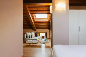 A bed or beds in a room at Tenuta Borgo Santa Cecilia Még 37 kép