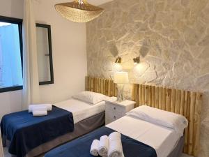 Posteľ alebo postele v izbe v ubytovaní Residence SardegnaSummer Li Cuppulati